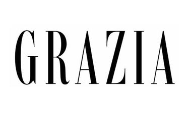 Das Bild zeigt das Wort GRAZIA in fetten, eleganten, schwarzen Großbuchstaben auf einem weißen Hintergrund.