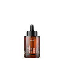 Eine braune Glastropfflasche mit der Aufschrift DALUMA PREBIOTIC PURIFYING GESICHTSSERUM steht aufrecht vor einem weißen Hintergrund und betont die Unterstützung der Hautbarriere und die Reduzierung von Unreinheiten.